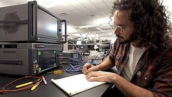 Engineer using testing equipment.