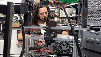 Engineer using testing equipment.