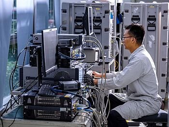 Engineer using testing equipment