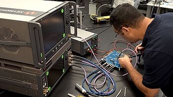 Engineer using testing equipment.